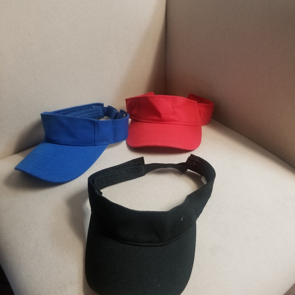 Red, blue and black sun visor hats